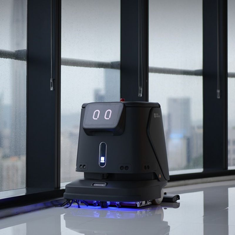 Robot laveur de sol professionnel PUDU CC1 ambiance du noir